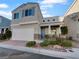 Two-story house with attached garage and landscaped front yard at 7627 Alexander Hills St, Las Vegas, NV 89139