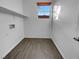 Laundry room with tile floor and built-in shelving at 7627 Alexander Hills St, Las Vegas, NV 89139