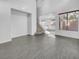 Bright living room with tile floors and staircase at 7627 Alexander Hills St, Las Vegas, NV 89139