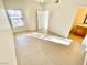 Bright bedroom with tile floors, window, and bathroom access at 8250 N Grand Canyon Dr # 1105, Las Vegas, NV 89166