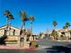 Gated entrance to an apartment community with palm trees and landscaping at 8250 N Grand Canyon Dr # 1105, Las Vegas, NV 89166