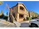 Two-story condo building with stairs and parking at 8250 N Grand Canyon Dr # 1105, Las Vegas, NV 89166