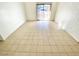 Spacious living room with tile floors and access to patio at 8250 N Grand Canyon Dr # 1105, Las Vegas, NV 89166