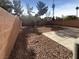 Landscaped backyard with gravel and concrete patio at 8465 Bellery Ave, Las Vegas, NV 89143