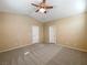 Spacious bedroom with two closets and a ceiling fan at 8465 Bellery Ave, Las Vegas, NV 89143