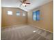 Large bedroom with vaulted ceilings, window, and ceiling fan at 8465 Bellery Ave, Las Vegas, NV 89143