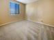 Simple bedroom with a window and wall-to-wall carpet at 8465 Bellery Ave, Las Vegas, NV 89143