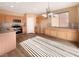 Kitchen with light wood cabinets and stainless steel appliances at 8465 Bellery Ave, Las Vegas, NV 89143