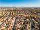 Aerial view of neighborhood showcasing homes and green spaces at 9037 Grayling Dr, Las Vegas, NV 89134