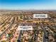 Aerial view of house and surrounding neighborhood, near golf course at 9037 Grayling Dr, Las Vegas, NV 89134