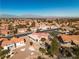 Single story home with red tile roof, backyard, and mountain views at 9037 Grayling Dr, Las Vegas, NV 89134