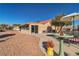 Landscaped backyard with patio furniture and a shaded area at 9037 Grayling Dr, Las Vegas, NV 89134