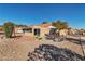 Backyard featuring desert landscaping and a patio area with outdoor seating at 9037 Grayling Dr, Las Vegas, NV 89134