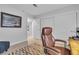 Bedroom with a brown leather desk chair and closet at 9037 Grayling Dr, Las Vegas, NV 89134