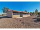 Back of a house, with desert landscaping, and a sunroom at 9037 Grayling Dr, Las Vegas, NV 89134