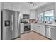 Bright kitchen with stainless steel appliances and a large window at 9037 Grayling Dr, Las Vegas, NV 89134