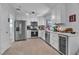 Modern kitchen with white cabinets, stainless steel appliances and quartz countertops at 9037 Grayling Dr, Las Vegas, NV 89134