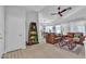 Comfortable living room featuring tile floors, ceiling fan, and leather couches at 9037 Grayling Dr, Las Vegas, NV 89134