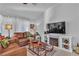 Cozy living room with leather furniture and a rustic coffee table at 9037 Grayling Dr, Las Vegas, NV 89134