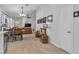 Open-concept living room and dining area with sleek floors and modern furniture at 9037 Grayling Dr, Las Vegas, NV 89134