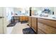 Double sink bathroom with wood cabinets and neutral tile at 904 Kevin Baker Ave, North Las Vegas, NV 89086