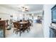 Bright dining room features a table with six chairs and views into the living room at 904 Kevin Baker Ave, North Las Vegas, NV 89086