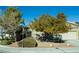 House exterior with mature trees and a landscaped front yard at 904 Kevin Baker Ave, North Las Vegas, NV 89086