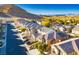 Aerial view of houses in a community with a mountain backdrop at 9328 Black Wolf Ave, Las Vegas, NV 89178