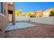 Small backyard with gravel and a concrete patio at 9328 Black Wolf Ave, Las Vegas, NV 89178