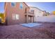 Small backyard with gravel and a concrete patio at 9328 Black Wolf Ave, Las Vegas, NV 89178