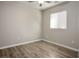 Bright bedroom with hardwood floors and a ceiling fan at 9328 Black Wolf Ave, Las Vegas, NV 89178