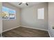 Well-lit bedroom featuring hardwood floors and window blinds at 9328 Black Wolf Ave, Las Vegas, NV 89178