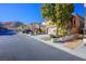 Two-story house with a landscaped yard and a two-car garage at 9328 Black Wolf Ave, Las Vegas, NV 89178