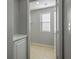 Laundry room with built-in shelving and window at 9328 Black Wolf Ave, Las Vegas, NV 89178