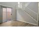 Living area with sliding door to backyard and staircase at 9328 Black Wolf Ave, Las Vegas, NV 89178