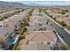 Aerial view of house and neighborhood; showcasing community, landscaping and pool at 9625 Ponderosa Skye Ct, Las Vegas, NV 89166