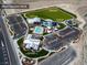 Aerial view showcasing Skye Canyon Park, sports field, pool, splashpad, fitness center and dining at 9625 Ponderosa Skye Ct, Las Vegas, NV 89166