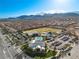 Aerial view showing community pool, playground and surrounding homes at 9625 Ponderosa Skye Ct, Las Vegas, NV 89166