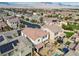 Drone shot of a community of homes featuring solar panels and community landscaping at 9625 Ponderosa Skye Ct, Las Vegas, NV 89166