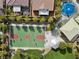 Aerial view of a community park, with a full basketball court, playground and covered seating at 9625 Ponderosa Skye Ct, Las Vegas, NV 89166