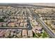 Aerial view of house and neighborhood; highlighting street and landscape at 9625 Ponderosa Skye Ct, Las Vegas, NV 89166