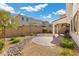 Landscaped backyard with patio, and string lights at 9625 Ponderosa Skye Ct, Las Vegas, NV 89166