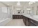 Spacious bathroom with double vanity and shower at 9625 Ponderosa Skye Ct, Las Vegas, NV 89166