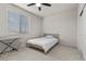 Bedroom with a ceiling fan, a window with blinds, and neutral walls at 9625 Ponderosa Skye Ct, Las Vegas, NV 89166