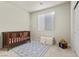 Charming bedroom with crib and play area at 9625 Ponderosa Skye Ct, Las Vegas, NV 89166