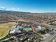 Aerial view of community center with pool and parking highlighting amenities in a residential neighborhood at 9625 Ponderosa Skye Ct, Las Vegas, NV 89166