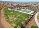 Aerial view of a community park with a playground and basketball court at 9625 Ponderosa Skye Ct, Las Vegas, NV 89166