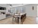 Dining area with a farmhouse table and wood chairs at 9625 Ponderosa Skye Ct, Las Vegas, NV 89166