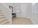 Bright and airy entryway with stairs and tile flooring at 9625 Ponderosa Skye Ct, Las Vegas, NV 89166