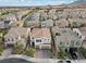 Aerial view of a two-story home with a tile roof, attached two-car garage, and well-maintained landscaping at 9625 Ponderosa Skye Ct, Las Vegas, NV 89166